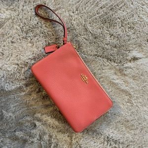 melon colored Coach wristlet